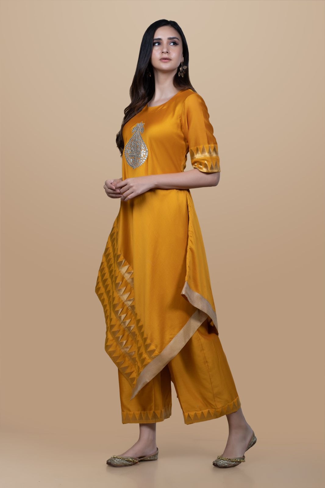 Buy - Prahnaaya gold mustard asymmetric flare kurta with pants | Elan Store